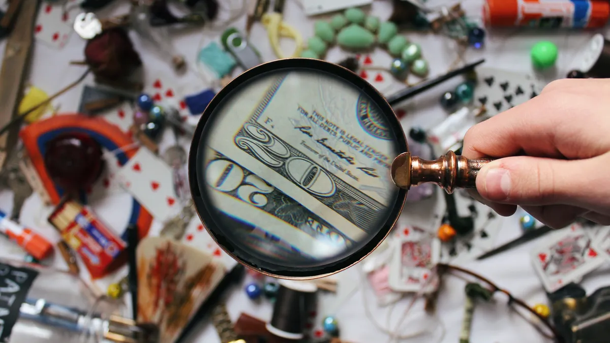AI search content systems and information architecture — The Complete Guide Magnifying glass over a cluttered desk of papers and objects