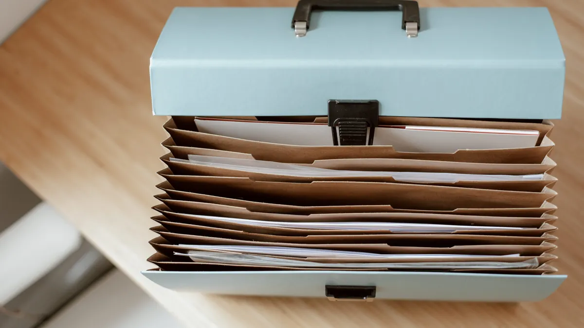 AI search content systems and information architecture — The Complete Guide File organizer with stacked paper folders