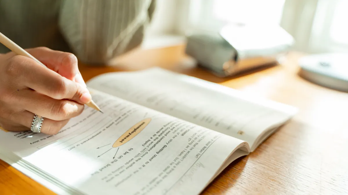 How to optimize a page for answer engines step by step — Person Answering a Textbook