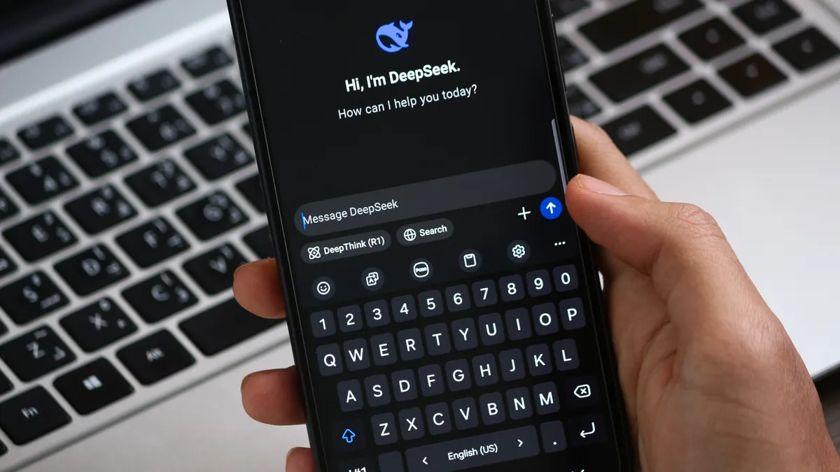 What is AI search optimization? Scope, goals, and where it fits What is AI search optimization? Scope, goals, and where it fits — Person Holding Smartphone with AI Chat Interface